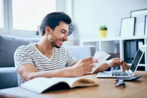 Requirements-page-Guy-looking-at-laptop